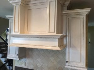 Simply White kitchen cabinets with a brown bronze glaze, a beautiful addition to any kitchen. Shown with accent detail work typical with every Richie's Refinishing project.